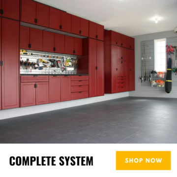 Complete dream garage setup with vehicle lift and Swisstrax flooring