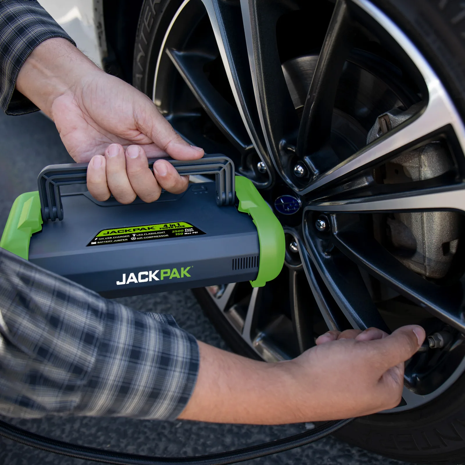 JackPak ULTRA2500A built-in air compressor inflating a car tire